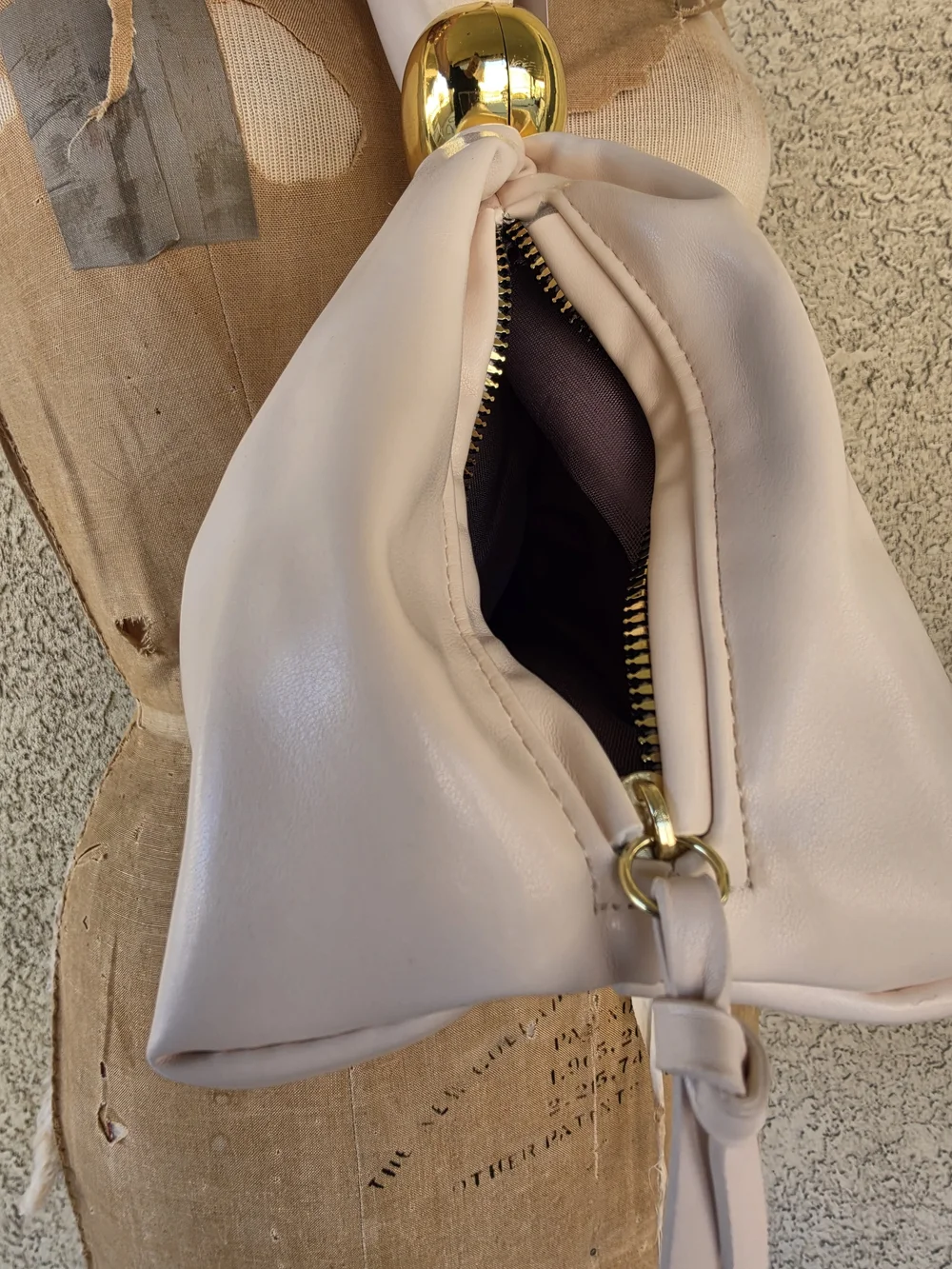 Elegant Cream Gathered Clutch with Gold Accent